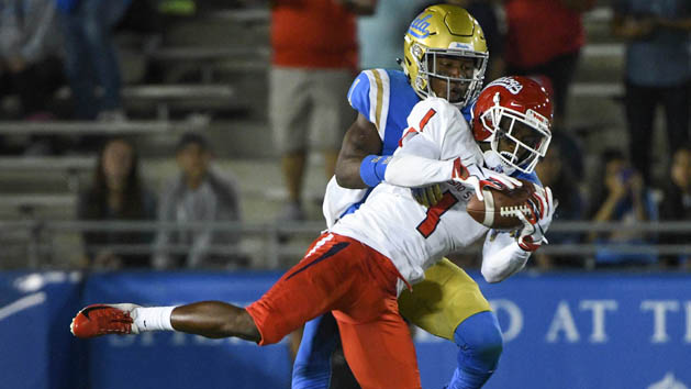 Sep 15, 2018; Pasadena, CA, USA; Fresno State Bulldogs wide receiver Jamire Jordan (1) makes a leaping catch on front of UCLA Bruins defensive back Darnay Holmes (1) in the third quarter at Rose Bowl. Photo Credit: Robert Hanashiro-USA TODAY Sports
