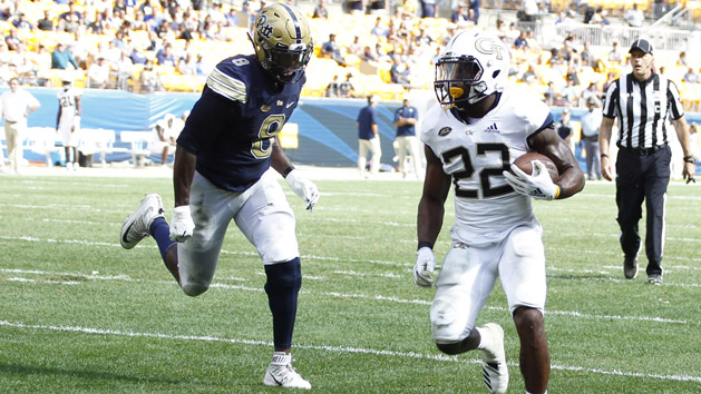 Sep 15, 2018; Pittsburgh, PA, USA; Georgia Tech Yellow Jackets running back Clinton Lynch (22) scores a touchdown past Pittsburgh Panthers linebacker Saleem Brightwell (9) during the fourth quarter at Heinz Field. Pittsburgh won 24-19. Photo Credit: Charles LeClaire-USA TODAY Sports