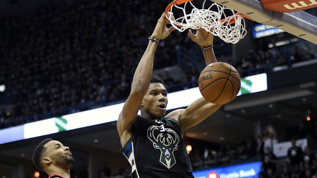 Apr 20, 2017; Milwaukee, WI, USA; Milwaukee Bucks forward Giannis Antetokounmpo (34) dunks a basket in the third quarter against Toronto Raptors guard Norman Powell (24) in game three of the first round of the 2017 NBA Playoffs at BMO Harris Bradley Center. Antetokounmpo scored 19 points to help the Bucks beat the Raptors 104-77. Photo Credit: Benny Sieu-USA TODAY Sports