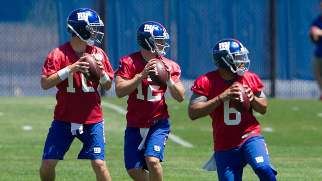 New York Giants quarterbacks Eli Manning (10), Ryan Nassib (12) and B.J. Daniels (6) run through a drill during mini camp at Quest Diagnostics Training Center. Photo Credit: William Hauser-USA TODAY Sports