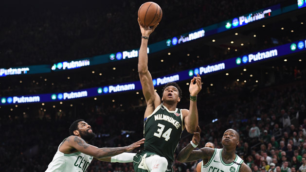 May 3, 2019; Boston, MA, USA; Milwaukee Bucks forward Giannis Antetokounmpo (34) drives to the basket against Boston Celtics guard Kyrie Irving (11) and guard Terry Rozier (12) during the second half in game three of the second round of the 2019 NBA Playoffs at TD Garden. Photo Credit: Bob DeChiara-USA TODAY Sports
