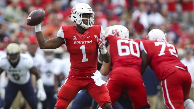 Nov 27, 2015; Houston, TX, USA; Houston Cougars quarterback Greg Ward Jr. (1) attempts a pass during the fourth quarter against the Navy Midshipmen at TDECU Stadium. The Cougars defeated the Midshipmen 52-31. Mandatory Credit: Troy Taormina-USA TODAY Sports
