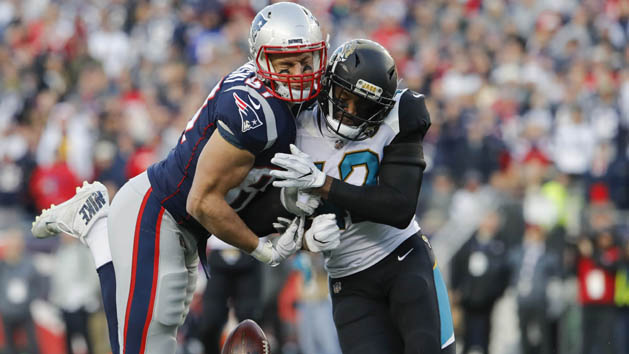 Jan 21, 2018; Foxborough, MA, USA; New England Patriots tight end Rob Gronkowski (87) is hit by Jacksonville Jaguars strong safety Barry Church (42) during the second quarter in the AFC Championship Game at Gillette Stadium. Photo Credit: David Butler II-USA TODAY Sports