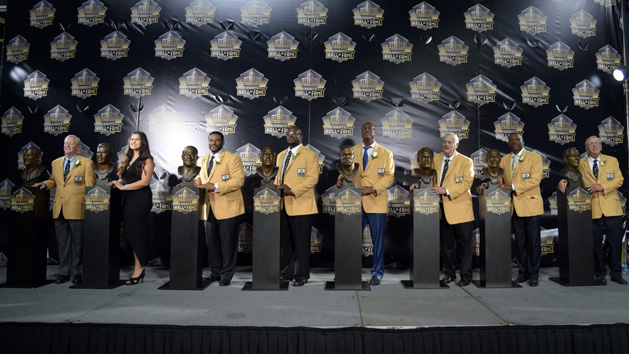 Aug 8, 2015; Canton, OH, USA; Enshrinees Bill Polian and Sydney Seau (representing father Junior Seau), Jerome Bettis and Will Shields and Charles Haley and Mick Tingelhoff and Tim Brown and Ron Wolf pose with their busts during the 2015 Pro Football Hall of Fame enshrinement at Tom Benson Hall of Fame Stadium. Photo Credit: Kirby Lee-USA TODAY Sports