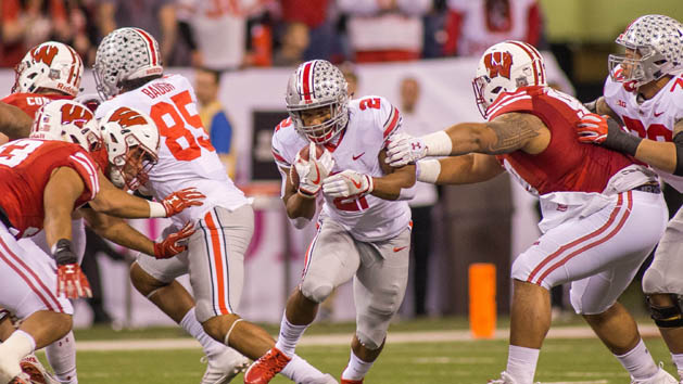 Dec 2, 2017; Indianapolis, IN, USA; Ohio State Buckeyes running back J.K. Dobbins (2) runs the ball while Wisconsin Badgers nose tackle Olive Sagapolu (99) tries to tackle him in the first half in the Big Ten championship game at Lucas Oil Stadium. Photo Credit: Trevor Ruszkowski-USA TODAY Sports