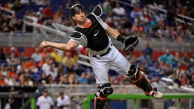 Sep 28, 2017; Miami, FL, USA; Miami Marlins catcher J.T. Realmuto (11) throws the ball to first base for an out in the third inning against the Atlanta Braves at Marlins Park. Photo Credit: Jasen Vinlove-USA TODAY Sports