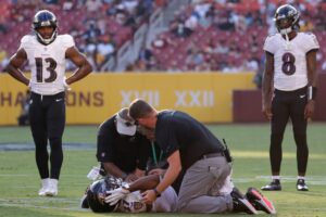 Ravens RB J.K. Dobbins carted off with knee injury