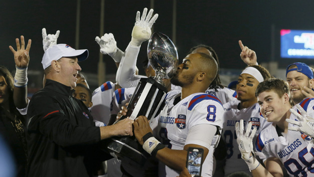 Dec 20, 2017; Frisco, TX, United States; Louisiana Tech Bulldogs quarterback J'Mar Smith (8) kisses the trophy after the game against the Southern Methodist Mustangs in the 2017 Frisco Bowl at Toyota Stadium. Photo Credit: Tim Heitman-USA TODAY Sports