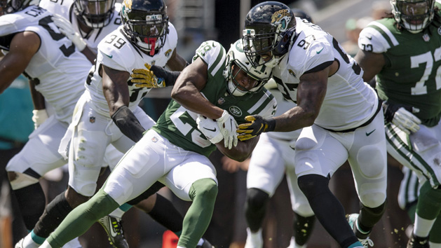Sep 30, 2018; Jacksonville, FL, USA; New York Jets running back Bilal Powell (29) is tackled by Jacksonville Jaguars defensive tackle Malik Jackson (97) during the first half at TIAA Bank Field. Photo Credit: Douglas DeFelice-USA TODAY Sports
