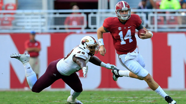 Sep 26, 2015; Tuscaloosa, AL, USA; Louisiana Monroe Warhawks defensive lineman Ben Banogu (49) reaches out for Alabama Crimson Tide quarterback Jake Coker (14) at Bryant-Denny Stadium. Mandatory Credit: Marvin Gentry-USA TODAY Sports