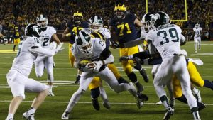 FBS Notebook: Michigan AD cautions angry fans