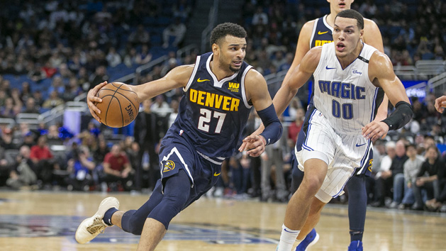 Dec 5, 2018; Orlando, FL, USA; Denver Nuggets guard Jamal Murray (27) drives past Orlando Magic forward Aaron Gordon (00) during the second half at Amway Center. Photo Credit: Reinhold Matay-USA TODAY Sports