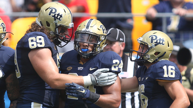 Sep 5, 2015; Pittsburgh, PA, USA; Pittsburgh Panthers running back James Conner (24) celebrates his second touchdown of the game with offensive lineman Adam Bisnowaty (69) and quarterback Chad Voytik (16) against the Youngstown State Penguins at Heinz Field. The Panthers won 45-37. Mandatory Credit: Charles LeClaire-USA TODAY Sports