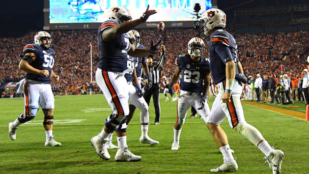 Nov 25, 2017; Auburn, AL, USA; Auburn Tigers quarterback Jarrett Stidham (8) celebrates his touchdown over the Alabama Crimson Tide during the fourth quarter at Jordan-Hare Stadium. Photo Credit: Christopher Hanewinckel-USA TODAY Sports