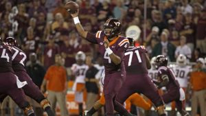 Evans passes, runs Hokies past Hurricanes