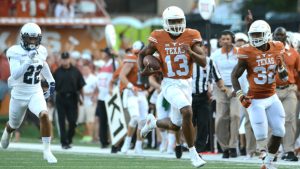Freshman Heard leads Texas to 42-28 win