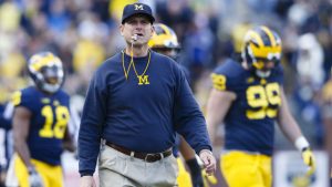 Michigan’s Harbaugh criticizes satellite camp ban