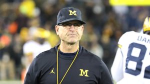 Michigan signs Harbaugh to four-year extension