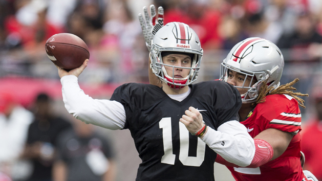 Apr 14, 2018; Columbus, OH, USA;Gray Team quarterback Joe Burrow (10) sends a pass upfield under pressure from Scarlet Team defensive end Chase Young (2) during the Spring Game at Ohio Stadium. Photo Credit: Greg Bartram-USA TODAY Sports