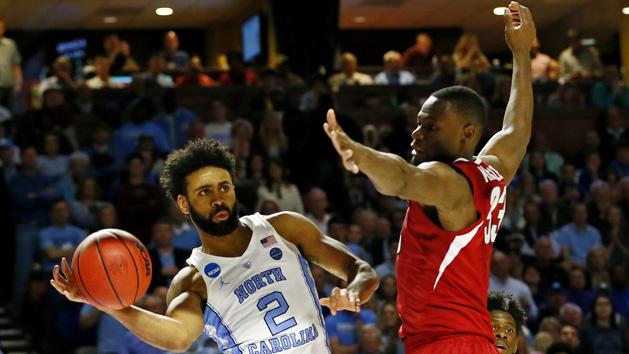 Mar 19, 2017; Greenville, SC, USA; North Carolina Tar Heels guard Joel Berry II (2) passes the ball against Arkansas Razorbacks forward Moses Kingsley (33) during the second half in the second round of the 2017 NCAA Tournament at Bon Secours Wellness Arena. Photo Credit: Jeremy Brevard-USA TODAY Sports