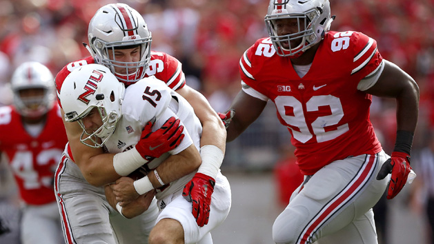 Sep 19, 2015; Columbus, OH, USA; Ohio State Buckeyes defensive lineman Joey Bosa (97) tackles Northern Illinois Huskies punter Jake Ambrose on a botched snap during the second quarter at Ohio Stadium. The game is tied 10-10 at half. Photo Credit: Joe Maiorana-USA TODAY Sports