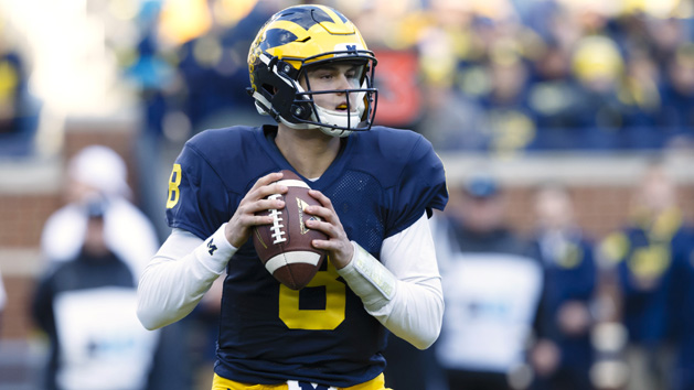 Apr 1, 2016; Ann Arbor, MI, USA; Michigan Wolverines quarterback John O'Korn (8) drops back to pass during the spring game at Michigan Stadium. Photo Credit: Rick Osentoski-USA TODAY Sports
