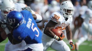 McCoy pushes Texas past Kansas
