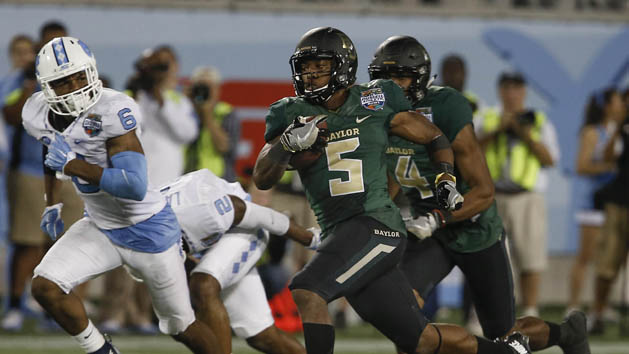 Dec 29, 2015; Orlando, FL, USA; Baylor Bears running back Johnny Jefferson (5) runs the ball 80 yards for a touchdown as North Carolina Tar Heels cornerback M.J. Stewart (6) gives chase during the second half of a football game at Florida Citrus Bowl. Baylor won 49-38. Mandatory Credit: Reinhold Matay-USA TODAY Sports