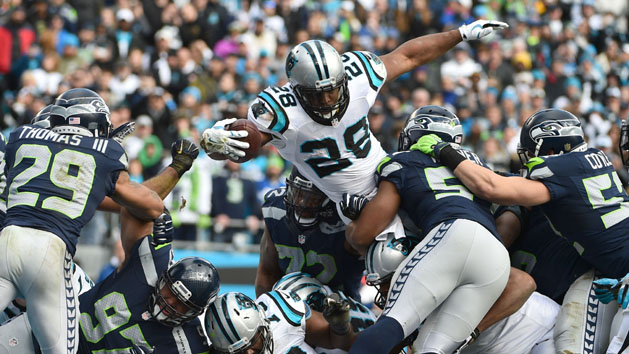Jan 17, 2016; Charlotte, NC, USA; Carolina Panthers running back Jonathan Stewart (28) scores on a 1 yard touchdown carry over Seattle Seahawks middle linebacker Bobby Wagner (54) and Brock Coyle (52) during the second quarter in a NFC Divisional round playoff game at Bank of America Stadium. Photo Credit: Kirby Lee-USA TODAY Sports