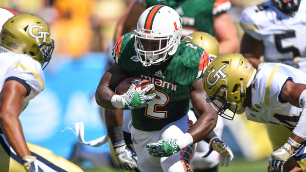 Oct 1, 2016; Atlanta, GA, USA; Miami Hurricanes running back Joseph Yearby (2) runs the ball through Georgia Tech Yellow Jackets defense during the first quarter at Bobby Dodd Stadium. Photo Credit: Shanna Lockwood-USA TODAY Sports