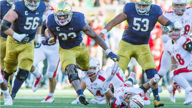 Sep 30, 2017; South Bend, IN, USA; Notre Dame Fighting Irish running back Josh Adams (33) runs the ball in the first quarter of the game against the Miami (Oh) Redhawks at Notre Dame Stadium. Photo Credit: Trevor Ruszkowski-USA TODAY Sports