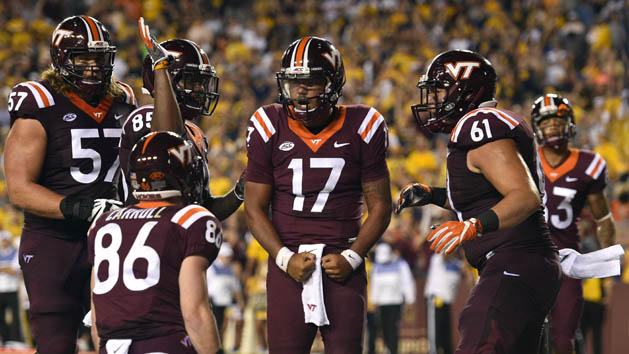 Sep 3, 2017; Landover, MD, USA; Virginia Tech Hokies quarterback Josh Jackson (17) celebrates with teammates after scoring a touchdown against the West Virginia Mountaineers during the second quarter at FedEx Field. Mandatory Credit: Derik Hamilton-USA TODAY Sports