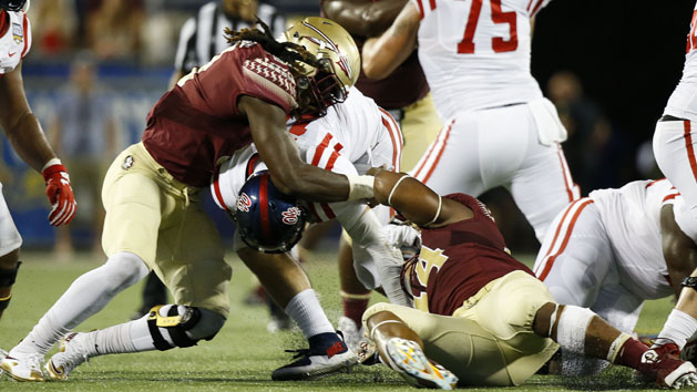 Sep 5, 2016; Orlando, FL, USA; Florida State Seminoles defensive end DeMarcus Walker (44) and defensive end Josh Sweat (9) tackle Mississippi Rebels quarterback Chad Kelly (middle) for a sack in the fourth quarter at Camping World Stadium. Florida State Seminoles won 45-34. Photo Credit: Logan Bowles-USA TODAY Sports