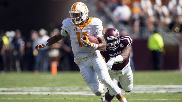 Oct 8, 2016; College Station, TX, USA; Tennessee Volunteers quarterback Joshua Dobbs (11) eludes Texas A&M Aggies defensive lineman Jarrett Johnson (40) during the first quarter at Kyle Field. Photo Credit: Jerome Miron-USA TODAY Sports