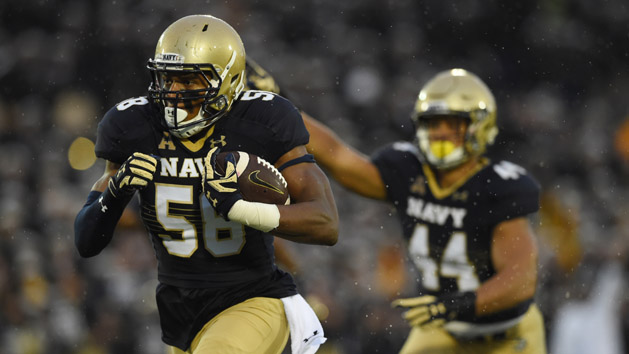 Oct 8, 2016; Annapolis, MD, USA; Navy Midshipmen linebacker Josiah Powell (58) returns a Houston Cougars quarterback Greg Ward Jr. (not pictured) for a touchdown during the third quarter at Navy Marine Corps Memorial Stadium. Navy defeated Houston 46-40. Photo Credit: Tommy Gilligan-USA TODAY Sports