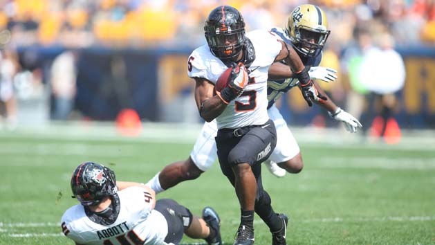 Sep 16, 2017; Pittsburgh, PA, USA; Oklahoma State Cowboys running back Justice Hill (5) runs the ball against the Pittsburgh Panthers during the first quarter at Heinz Field. The Cowboys won 59-21. Photo Credit: Charles LeClaire-USA TODAY Sports