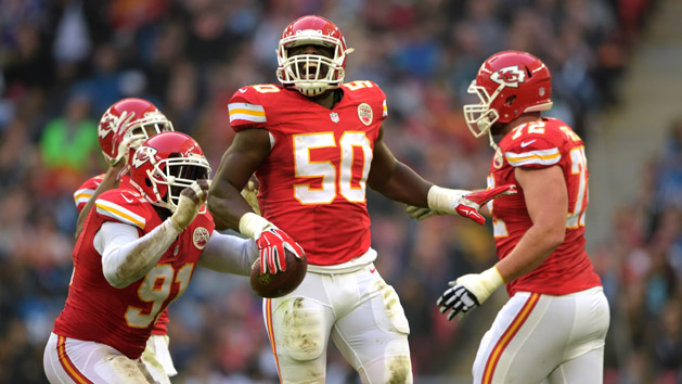 Nov 1, 2015; London, United Kingdom; Kansas City Chiefs linebacker Justin Houston (50) celebrates with teammates Tamba Hall (91) and Eric Fisher (72) after intercepting a pass in the second quarter against the Detroit Lions during game 14 of the NFL International Series at Wembley Stadium. Mandatory Credit: Kirby Lee-USA TODAY Sports