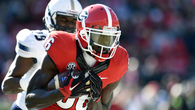 Justin Scott-Wesley (86) catches a touchdown pass against Charleston Southern Buccaneers defensive back Lorenzo Mathis (28) during the first quarter at Sanford Stadium. (Dale Zanine-USA TODAY Sports)