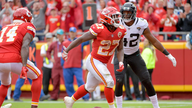Oct 7, 2018; Kansas City, MO, USA; Kansas City Chiefs running back Kareem Hunt (27) celebrates as Jacksonville Jaguars strong safety Barry Church (42) looks on during the second half at Arrowhead Stadium. Mandatory Credit: Denny Medley-USA TODAY Sports