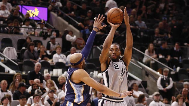 Apr 15, 2017; San Antonio, TX, USA; San Antonio Spurs small forward Kawhi Leonard (2) shoots the ball over Memphis Grizzlies shooting guard Vince Carter (left) during the second half in game one of the first round of the 2017 NBA Playoffs at AT&T Center. Photo Credit: Soobum Im-USA TODAY Sports