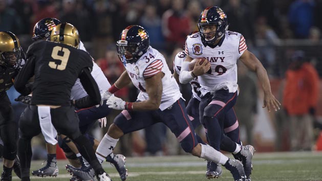 Dec 13, 2014; Baltimore, MD, USA; Navy Midshipmen quarterback Keenan Reynolds (19) rushes for a first down during the fourth quarter of the 115th annual Army-Navy game against the Army Black Knights at M&T Bank Stadium. Navy Midshipmen defeated Army Black Knights 17-10. Mandatory Credit: Tommy Gilligan-USA TODAY Sports