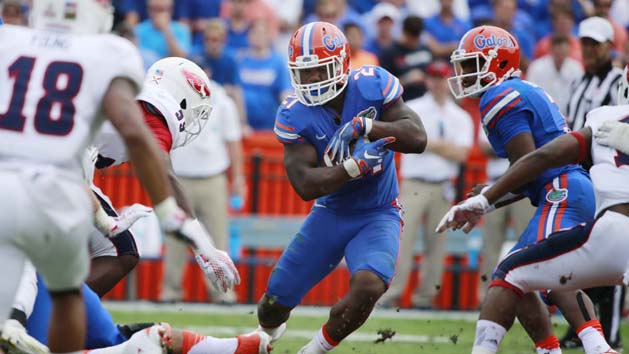 Nov 21, 2015; Gainesville, FL, USA; Florida Gators running back Kelvin Taylor (21) runs with the ball against the Florida Atlantic Owls during the first quarter at Ben Hill Griffin Stadium. Mandatory Credit: Kim Klement-USA TODAY Sports