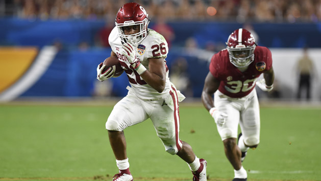 Dec 29, 2018; Miami Gardens, FL, USA; Oklahoma Sooners running back Kennedy Brooks (26) runs the ball against Alabama Crimson Tide linebacker Mack Wilson (30) during the third quarter of the 2018 Orange Bowl college football playoff semifinal game at Hard Rock Stadium. Photo Credit: John David Mercer-USA TODAY Sports