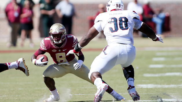 Oct 17, 2015; Tallahassee, FL, USA; Florida State player Kermit Whitfield (8) tries to escape Louisville defender Sheldon Rankins (98) as the Florida State Seminoles beat the Louisville Cardinals 41-21 at Doak Campbell Stadium. Mandatory Credit: Glenn Beil-USA TODAY Sports