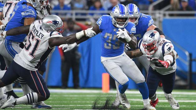 Sep 23, 2018; Detroit, MI, USA; Detroit Lions running back Kerryon Johnson (33) runs the ball as New England Patriots linebacker Ja'Whaun Bentley (51) and linebacker Elandon Roberts (52) attempt to tackle during the game at Ford Field. Photo Credit: Tim Fuller-USA TODAY Sports