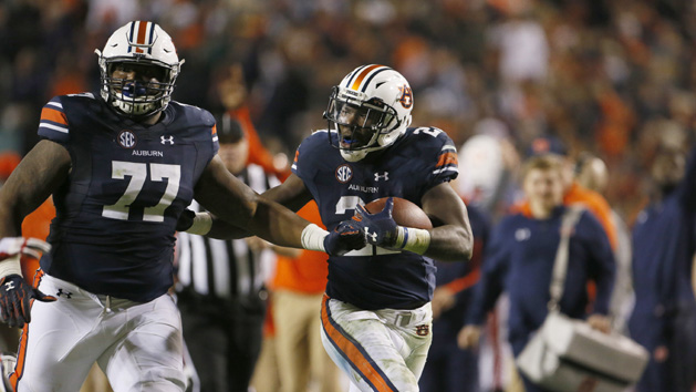 Nov 11, 2017; Auburn, AL, USA; Auburn Tigers running bak Kerryon Johnson (21) runs behind the block of lineman Marquel Harrell (77) and scores a touchdown against the Georgia Bulldogs during the fourth quarter at Jordan-Hare Stadium. Photo Credit: John Reed-USA TODAY Sports