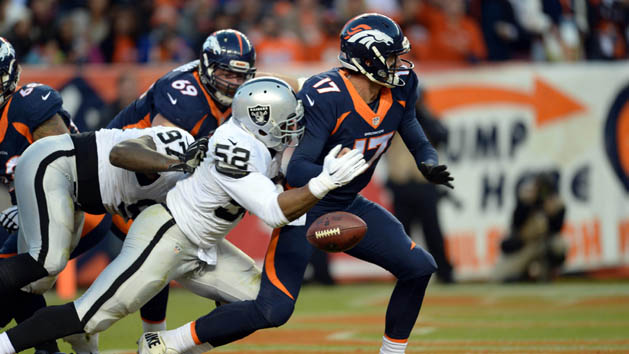 Dec 13, 2015; Denver, CO, USA; Oakland Raiders defensive end Khalil Mack (52) strip sacks Denver Broncos quarterback Brock Osweiler (17) in the end zone in the third quarter at Sports Authority Field at Mile High. Mandatory Credit: Ron Chenoy-USA TODAY Sports