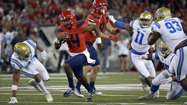 Oct 14, 2017; Tucson, AZ, USA; Arizona Wildcats quarterback Khalil Tate (14) runs the ball as UCLA Bruins linebacker Kenny Young (42) defends during the second half at Arizona Stadium. Photo Credit: Casey Sapio-USA TODAY Sports