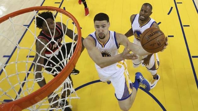 May 3, 2016; Oakland, CA, USA; Golden State Warriors guard Klay Thompson (11) goes up for a shot against Portland Trail Blazers center Ed Davis (17) during the first half in game two of the second round of the NBA Playoffs at Oracle Arena. The Warriors defeated the Trail Blazers 110-99. Mandatory Credit: Ezra Shaw-Pool Photo via USA TODAY Sports