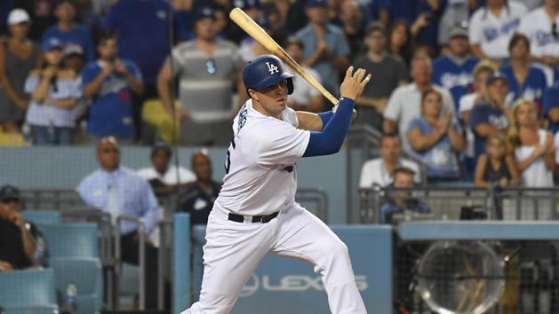 Jul 30, 2017; Los Angeles, CA, USA; Los Angeles Dodgers pinch hitter Kyle Farmer hits a walk off two-run double against the San Francisco Giants in the 11th inning at Dodger Stadium. Photo Credit: Richard Mackson-USA TODAY Sports